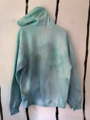 the back side of a tie dye fabric hoodie